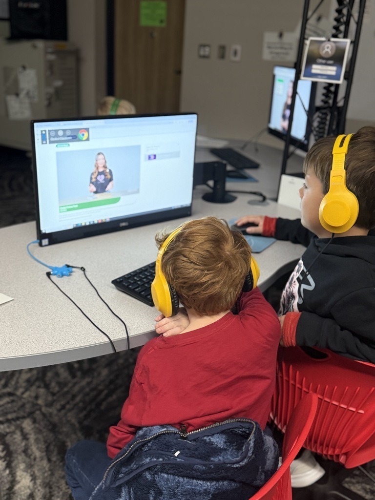 Elementary STEM students working on their robots.