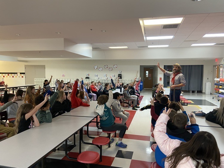 Cowboy Bart showing elementary students rope tricks