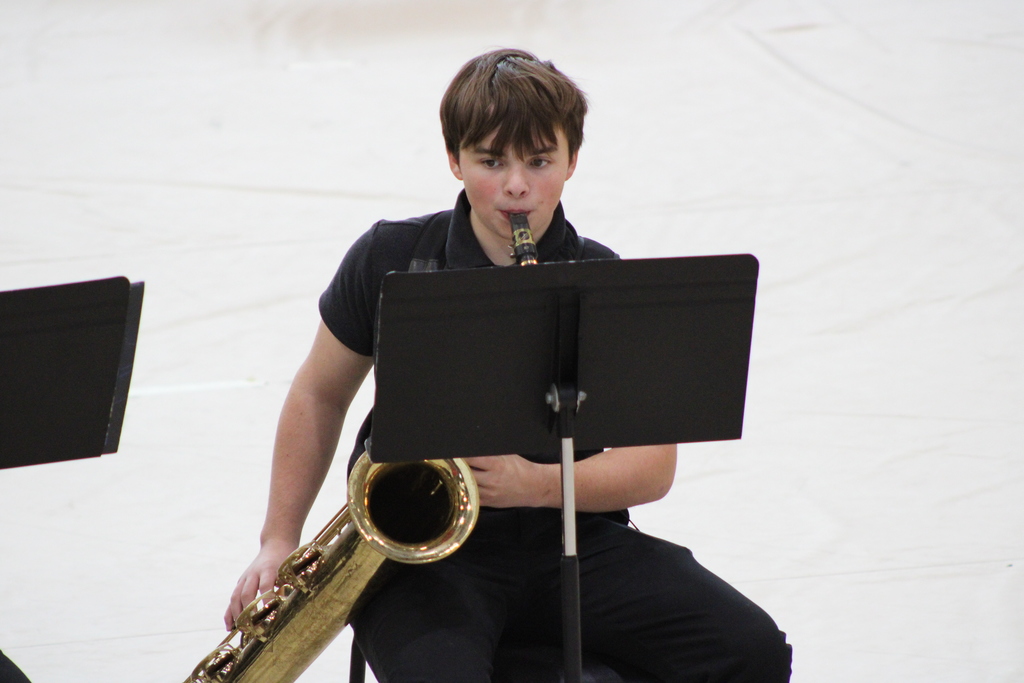 Student playing bari sax at contest