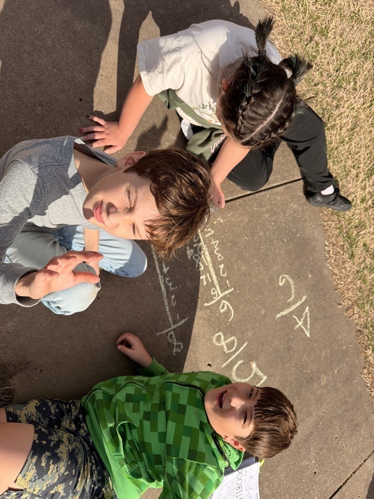 Westside fifth graders working on fractions outside.