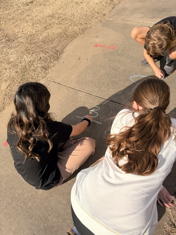 Westside fifth graders working on fractions outside.