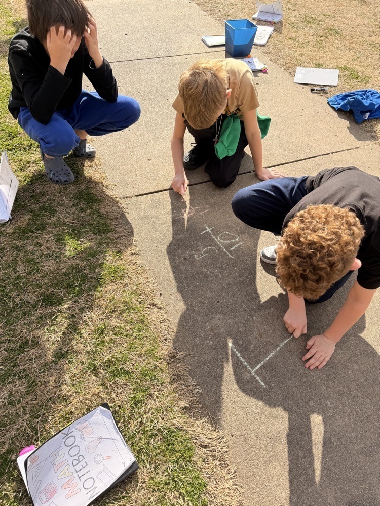Westside fifth graders working on fractions outside.