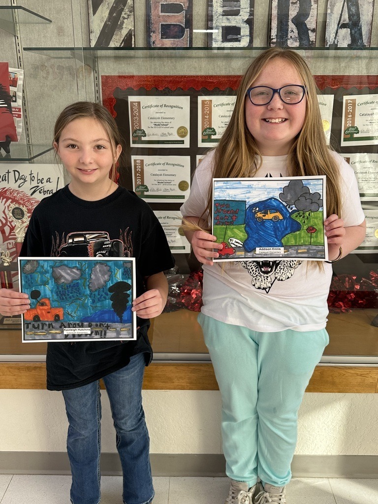 Catalayah student with art work.