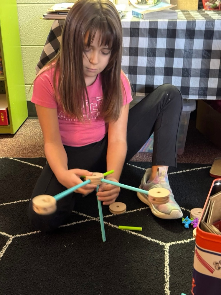 student playing with manipulatives 