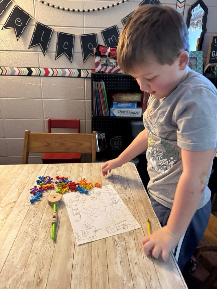 student playing with manipulatives 