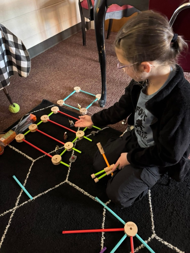 student playing with manipulatives 