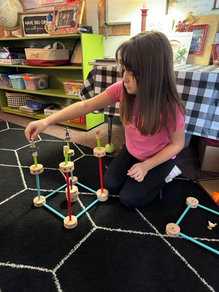 student playing with manipulatives 