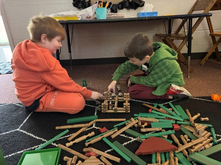 student playing with manipulatives 