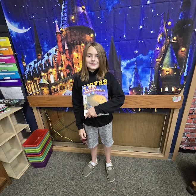 Student holding a book 