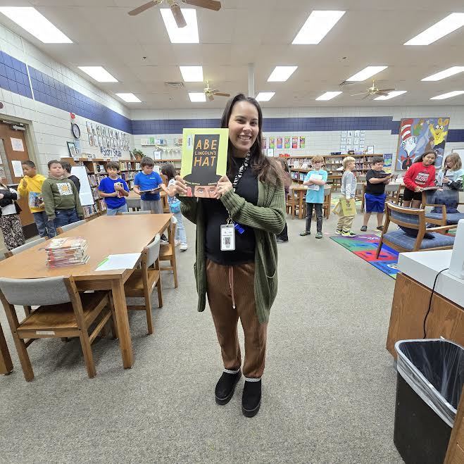 teacher holding book