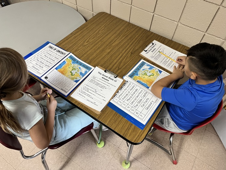 students working on Alaska text 