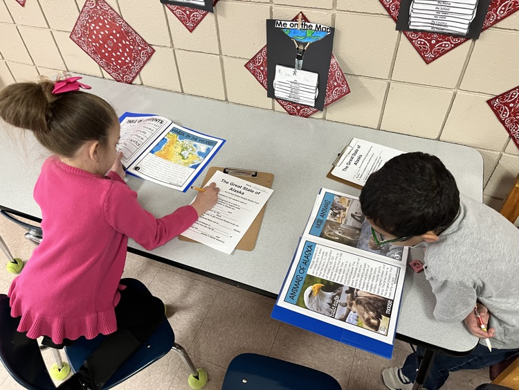 students working on Alaska text 