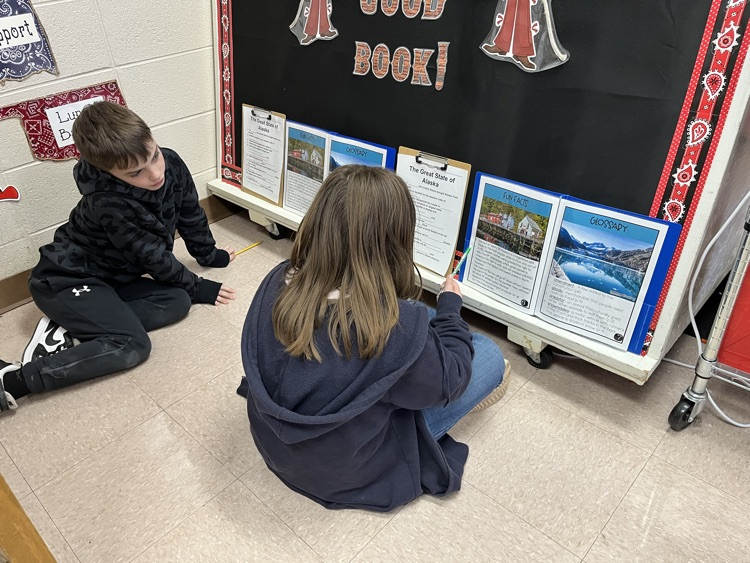 students working on Alaska text 