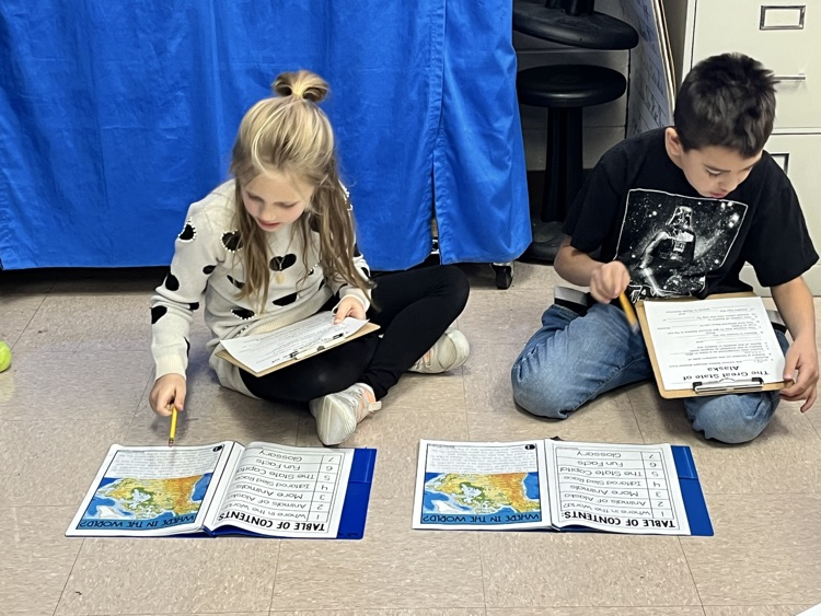 students working on Alaska text 