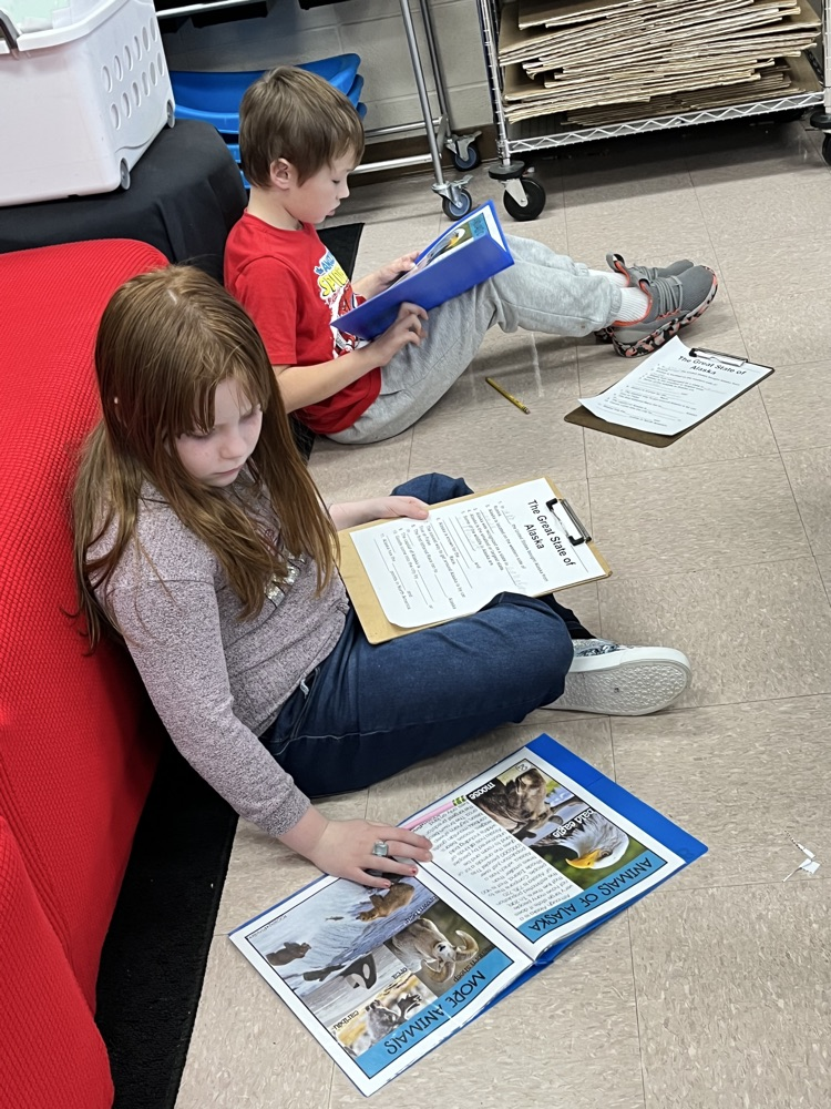 students working on Alaska text 