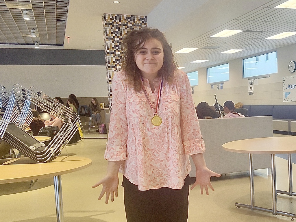 Student shrugging in a lunch room