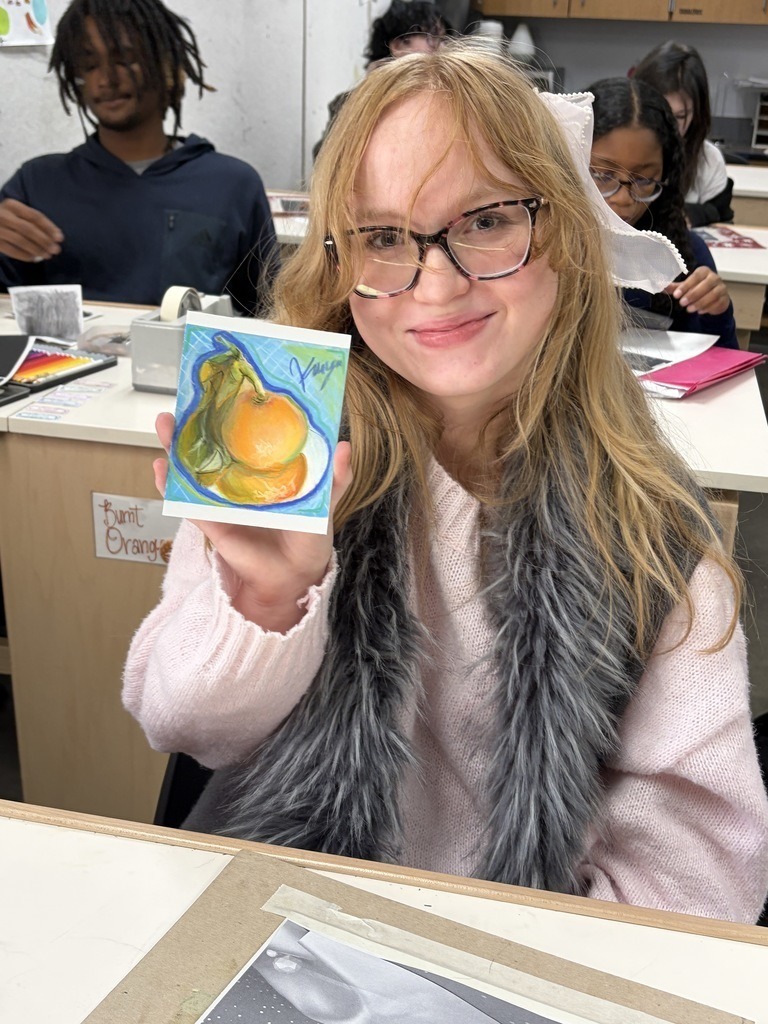 student with thier artwork