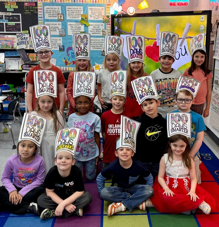 first graders wearing 100 days smarter hat