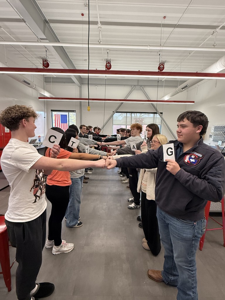 🧬🧑‍🔬 DNA in Coach Davis’s Biology! 🧑‍🔬🧬  Students in Coach Davis’s Biology class teamed up to become a living DNA molecule, pairing up as nitrogen bases to follow real base-pairing rules (A with T, C with G). Together they formed a full double helix, showing how genetic information is organized inside every cell.  By building the strand themselves, students could see how structure, bonding, and accuracy all matter — because even one mistake in the sequence can change the final product. Hands-on learning made the code of life a little easier to understand!