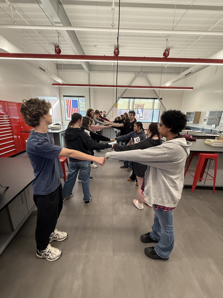 🧬🧑‍🔬 DNA in Coach Davis’s Biology! 🧑‍🔬🧬  Students in Coach Davis’s Biology class teamed up to become a living DNA molecule, pairing up as nitrogen bases to follow real base-pairing rules (A with T, C with G). Together they formed a full double helix, showing how genetic information is organized inside every cell.  By building the strand themselves, students could see how structure, bonding, and accuracy all matter — because even one mistake in the sequence can change the final product. Hands-on learning made the code of life a little easier to understand!