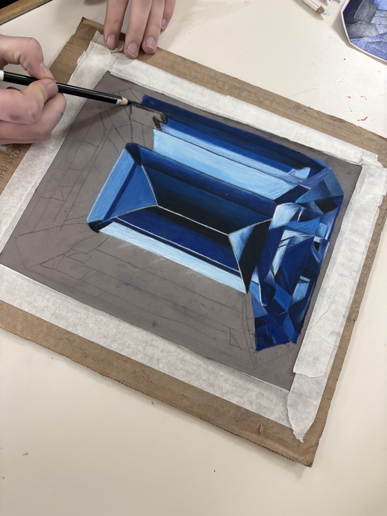 Art 1 students are diving into colored pencil techniques with dazzling gemstone drawings! From smooth blending to bold highlights, their shading skills are shining through. Advanced students pushed themselves even further by working with pastel pencils for the first time. This marks the first realistic, full-color drawing of the semester—and their growth is seriously blowing us away!