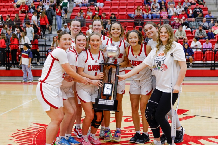 girls basketball team with a trophy