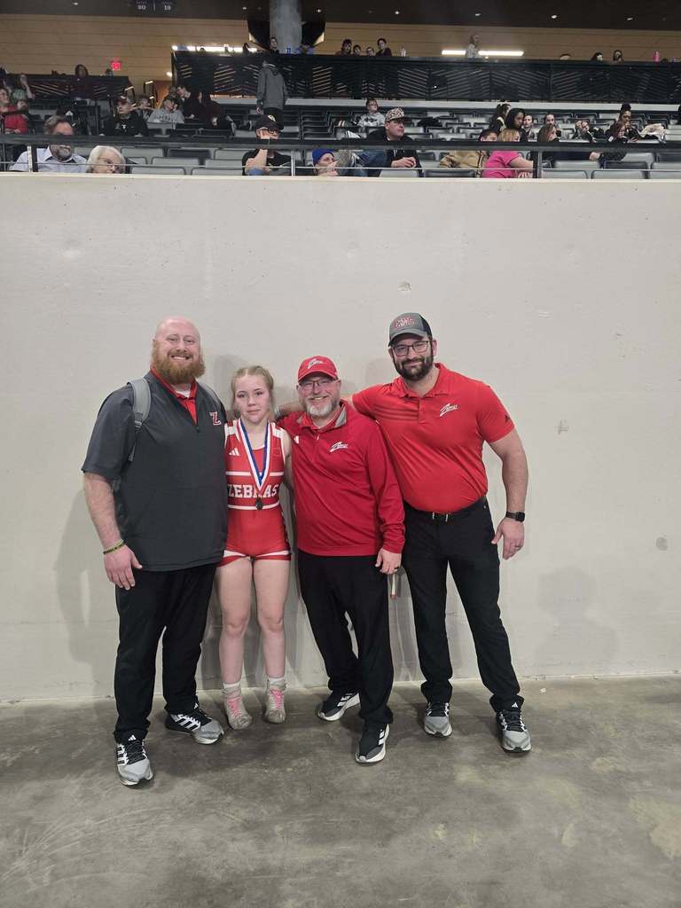 lady zebra wrestlers with thier medals 