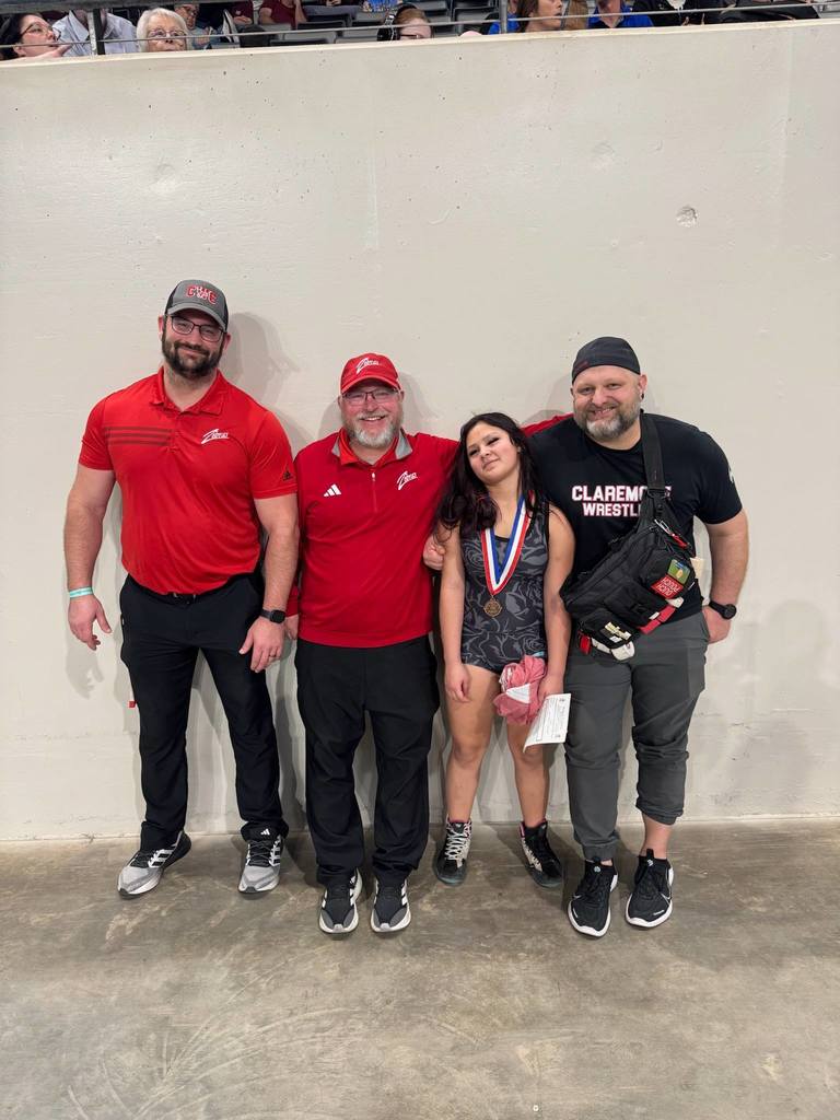 lady zebra wrestlers with thier medals 