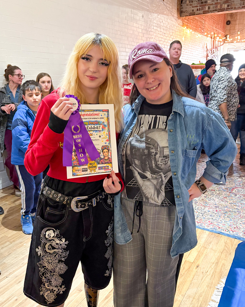 Amelia and Miss Hoffer at art show.