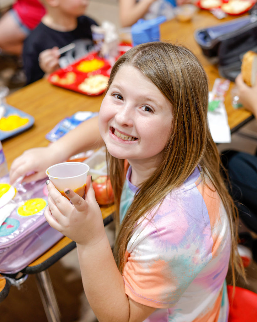 Elementary student happy about their lunch