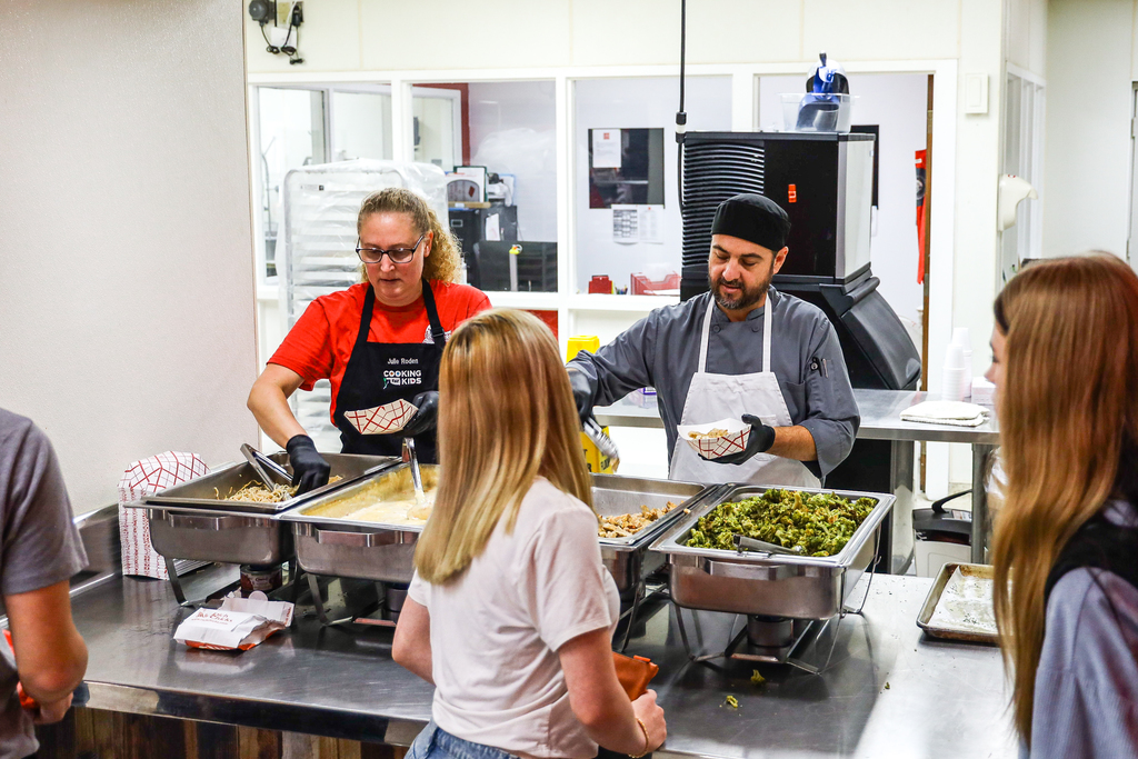 High school kitchen staff serving students