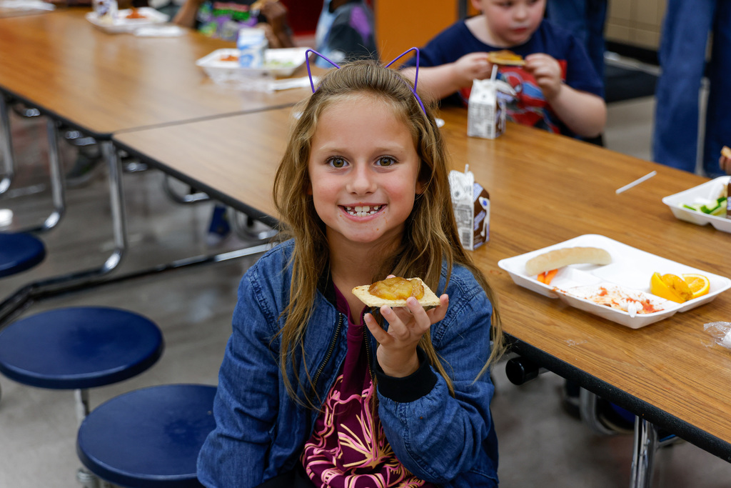Elementary student happy about their lunch