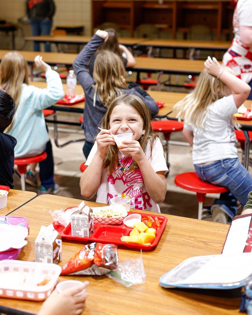 Elementary student happy about their lunch
