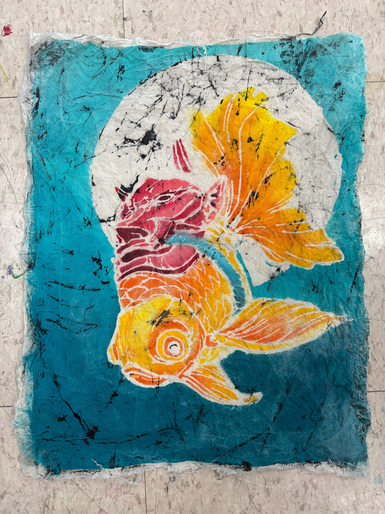 Completed coy fish in art.  orange fish with teal ocean water around him