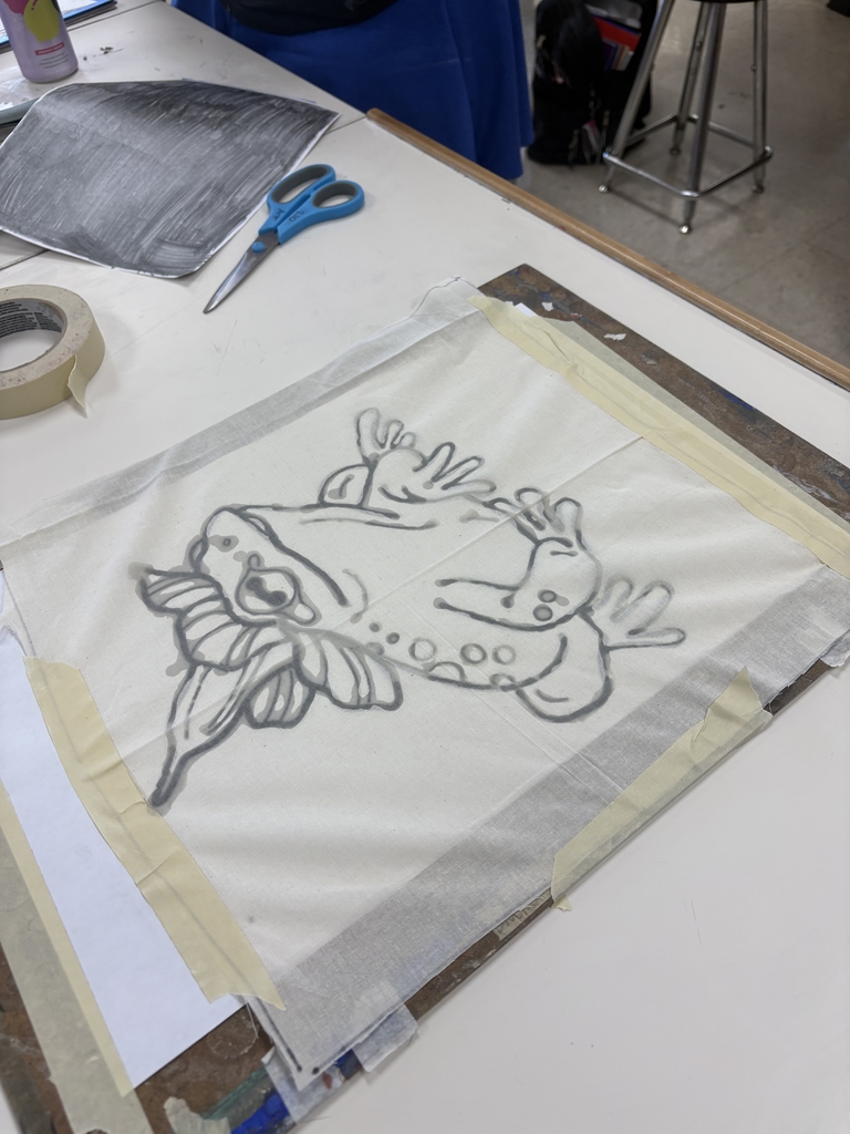 Batik art of a frog with a flower on its head