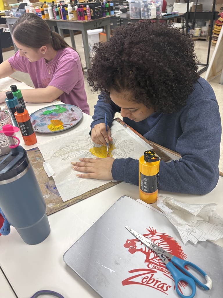 student in art working on art project