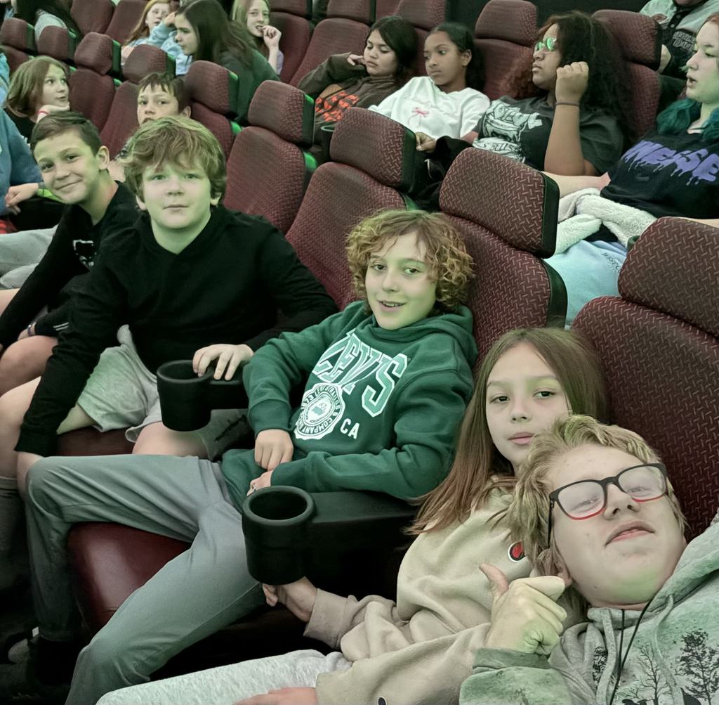 students smiling during presentation