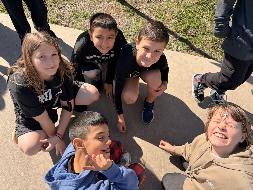 students circled up smiling