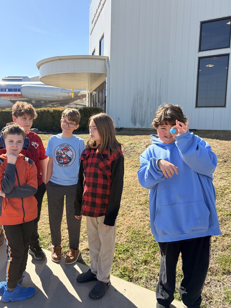 students smiling outside