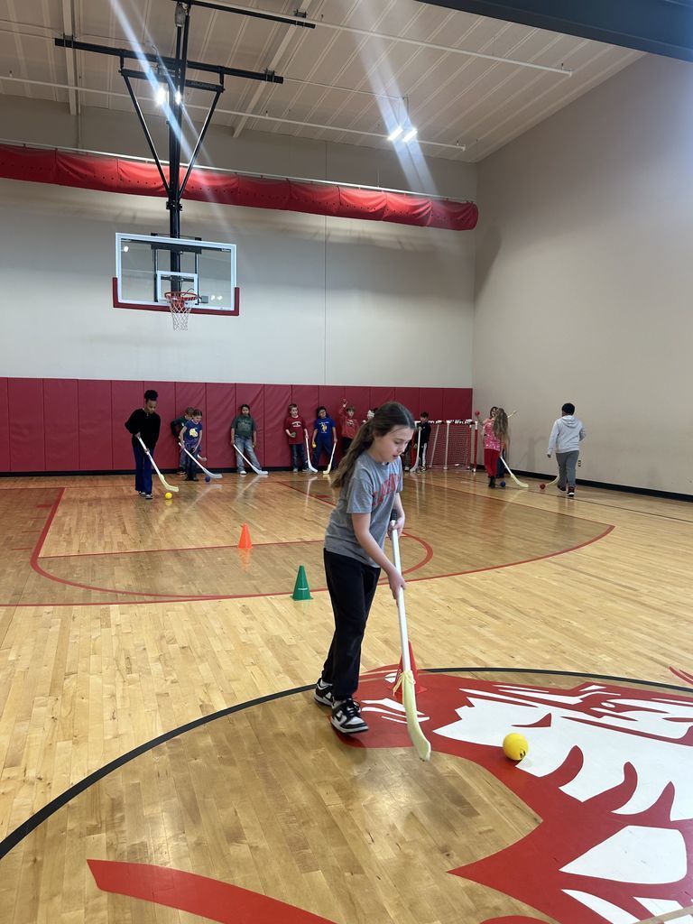 student playing hockey