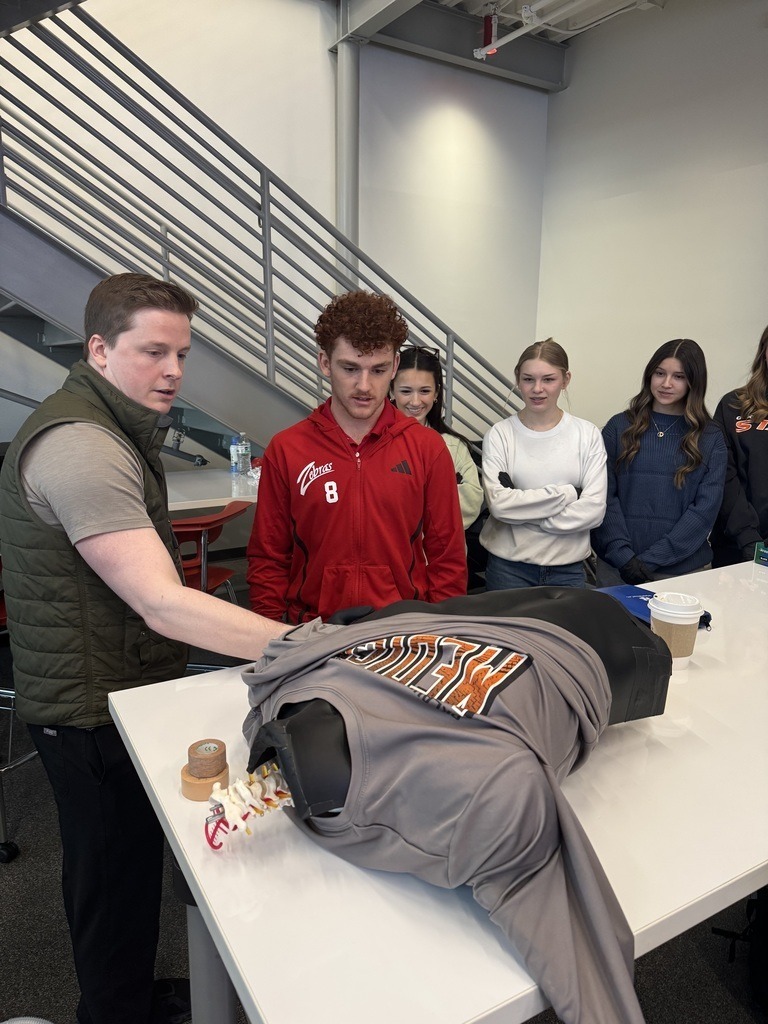 Claremore High School BioMed students doing hands on work.
