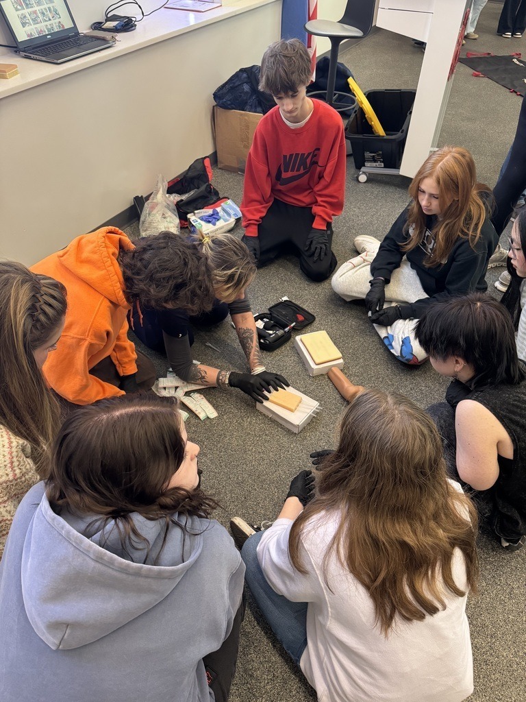 Claremore High School BioMed students doing hands on work.