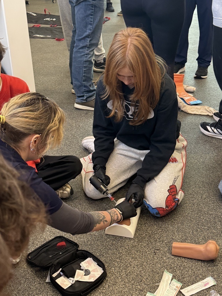 Claremore High School BioMed students doing hands on work.