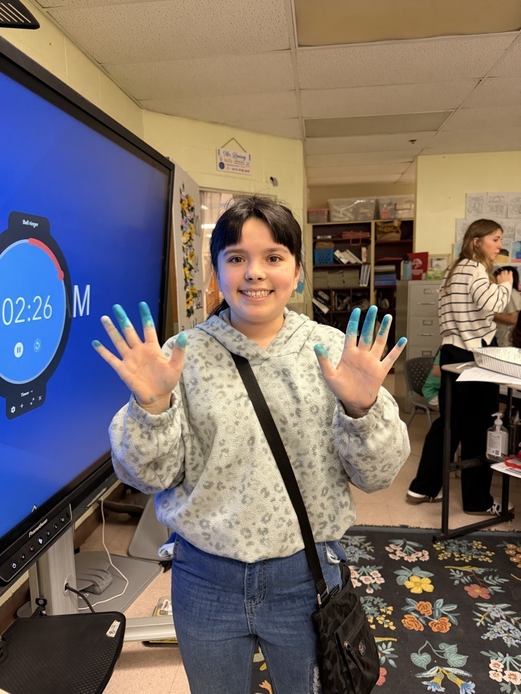 Fifth graders doing science experiments with R.S.U Students.