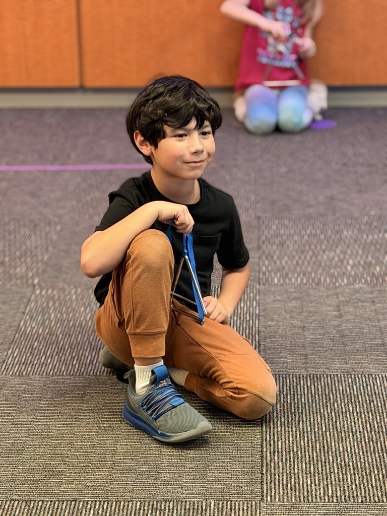 Catalayah Elementary student playing the triangle.