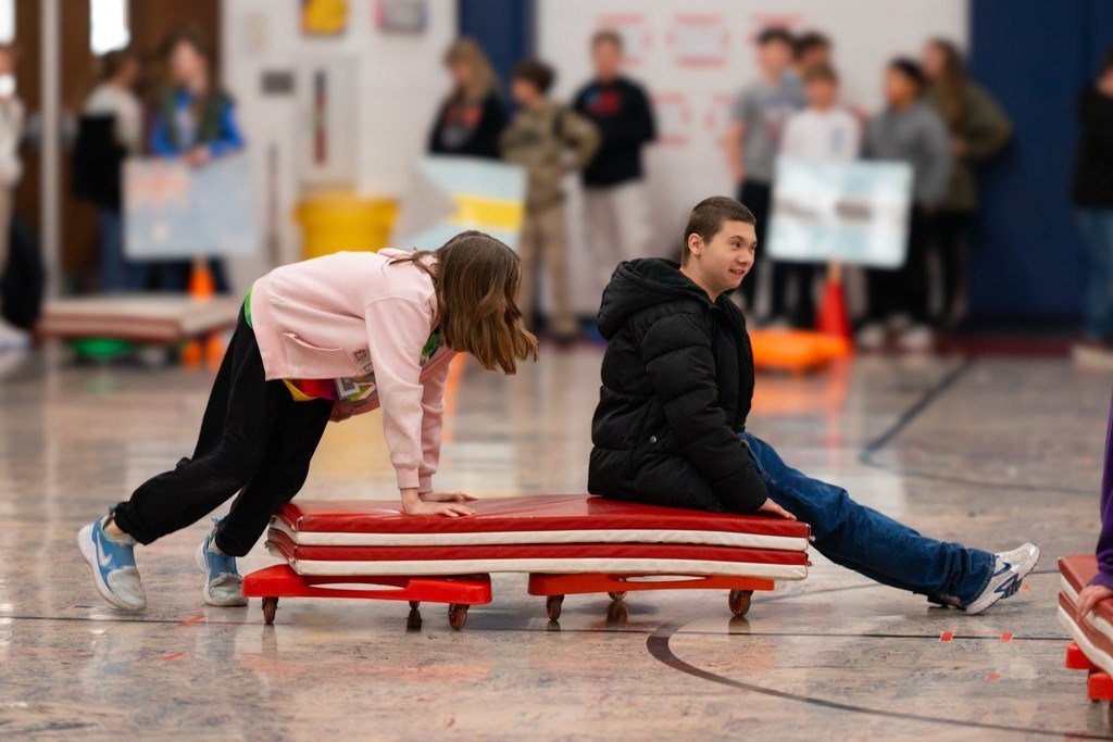 Roosa fifth graders playing bobsled.