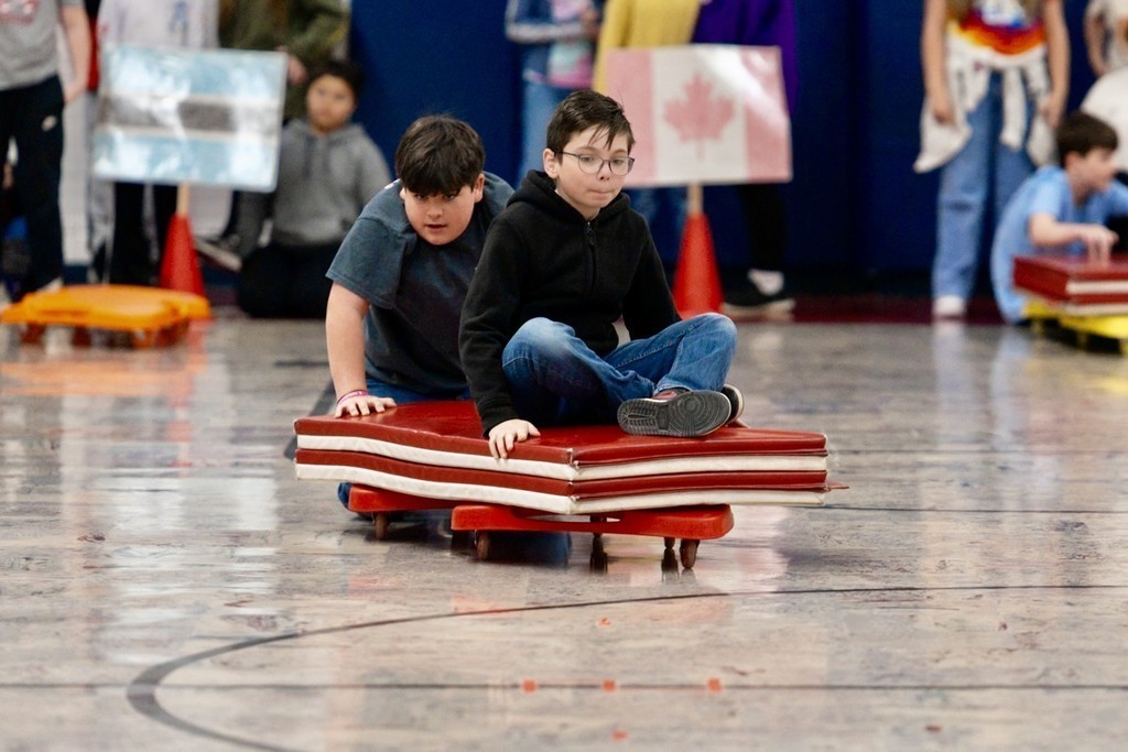 Roosa fifth graders playing bobsled.