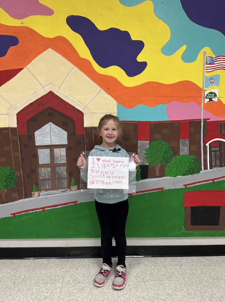 girl holding white board