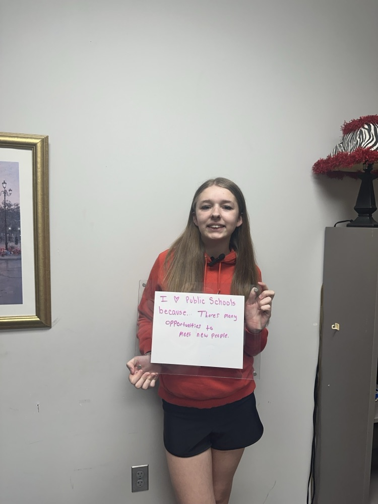 girl holding white board