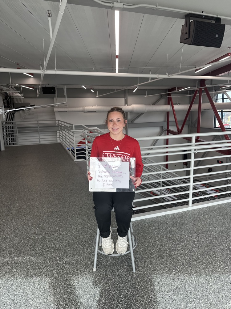 girl holding white boy